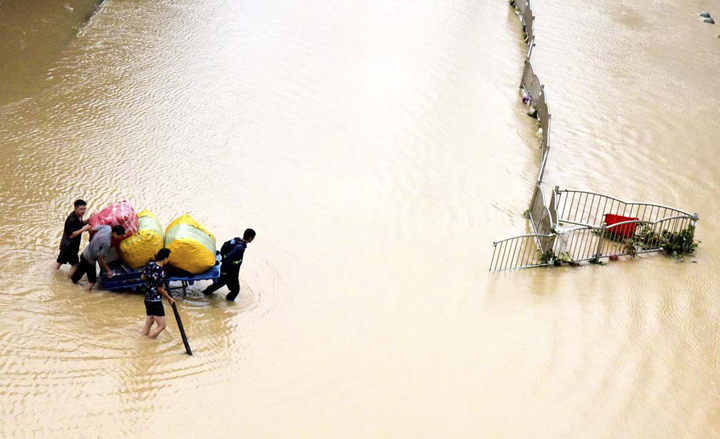 China blasts dam to divert floods that killed at least 25