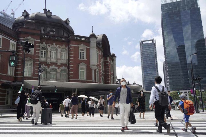 Japan to further expand Covid emergency areas as cases surge