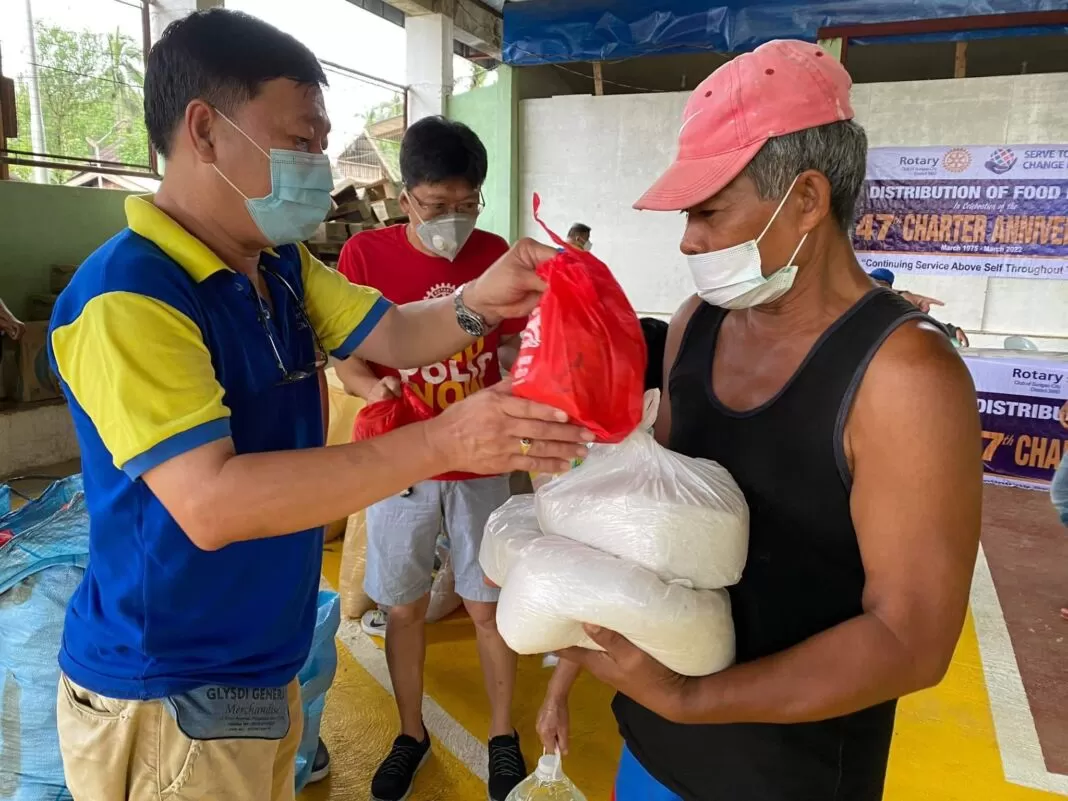 Residents of Magtangale, San Francisco received food packs from rotary club of Surigao city