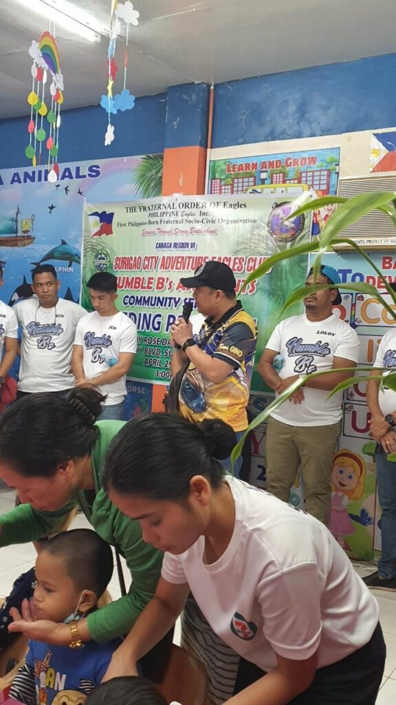 one of the Eagle member speaking in front of the children