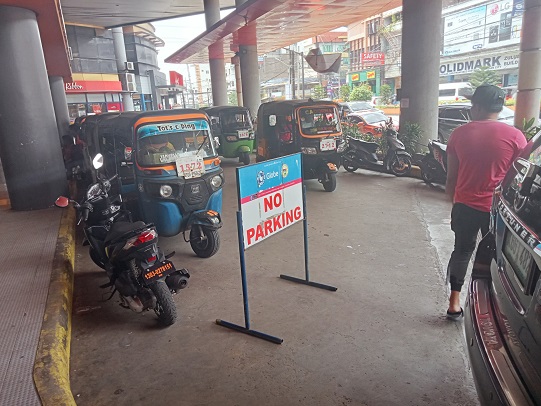parked motorcycle on no parking spon